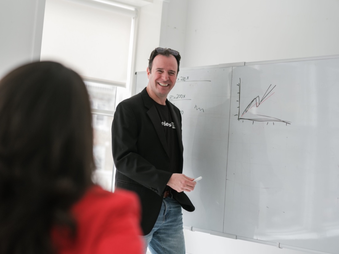 Greg Raiz speaking at an event